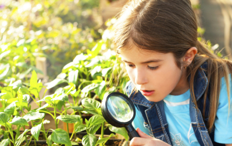 Girl with magnifier by Shutterstock.com/panco971