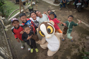 Loris mascot with villagers by Andrew Walmsley