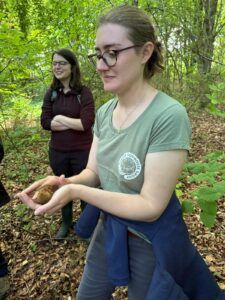 Dormouse monitor, Lisa Wood, holding a dormouse on a box check in Surrey - People's Trust for Endangered Species